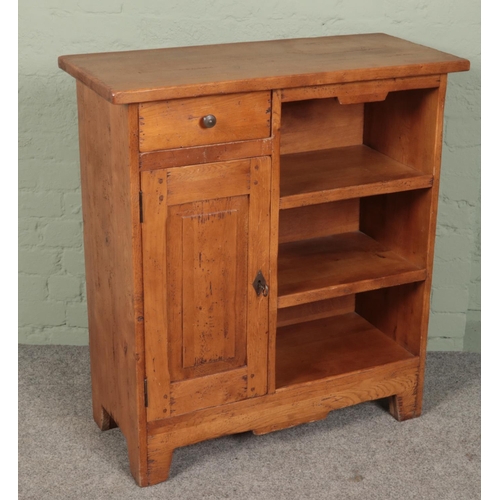 414 - An oak side cabinet with drawer, cupboard and shelves. (99cm x 90cm x 39cm)