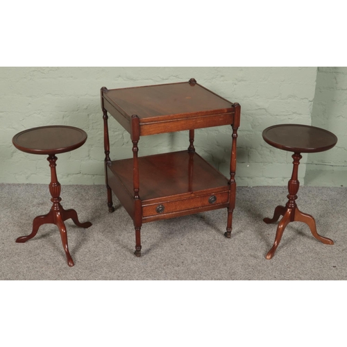 417 - A pair of carved mahogany wine tables along with a Regency style mahogany two tier occasional table.... 