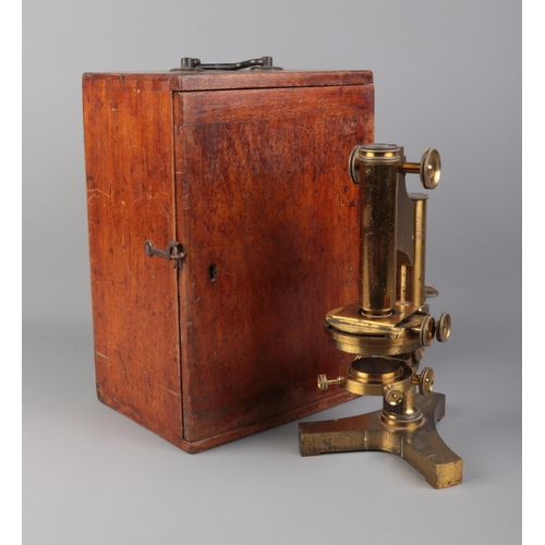 2 - A cased R & J Beck cased brass microscope with selection of accessories and lenses.