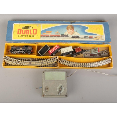 23 - A boxed Meccano Hornby Dublo electric train set along with a Meccano power station.