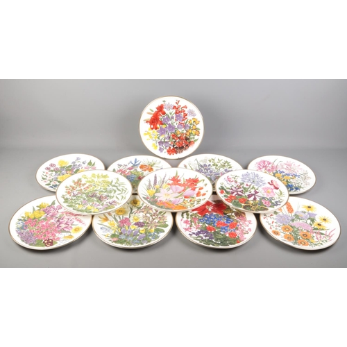 31 - Franklin Porcelain; twelve RHS 'Flowers of the Year' cabinet plates, depicting flowers of the month,... 