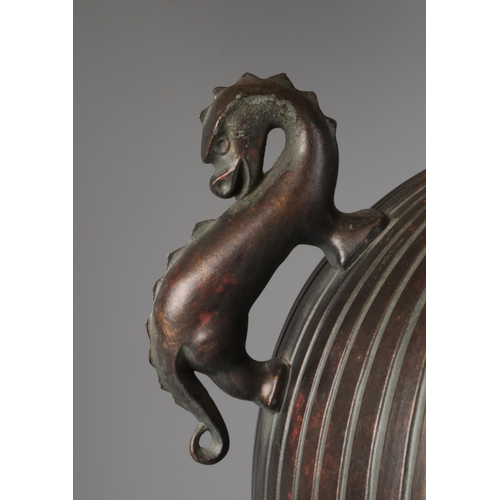 43 - A large bronzed metal table lamp with dragon twin handles. (94cm)