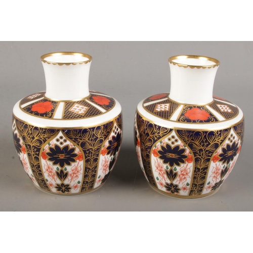 362 - A pair of Royal Crown Derby Imari baluster shape vases. 1128 pattern, 11cm. First quality.