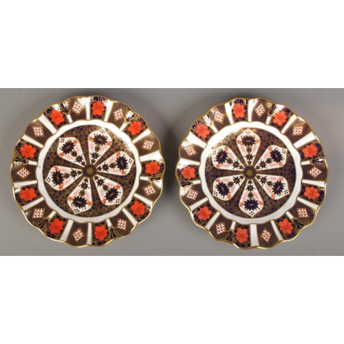 363 - A pair of Royal Crown Derby Imari plates. 1128 pattern. (22cm diameter). First quality.