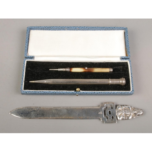 377 - Two small pieces of silver, to include a protracting pencil assayed for London, 1933 and Peru 925 si... 