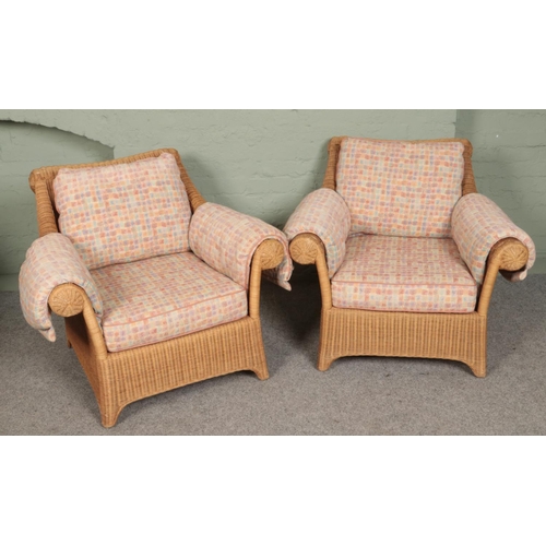 388 - A four piece rattan conservatory suite. Comprising of a pair of two seat sofas and two armchairs.