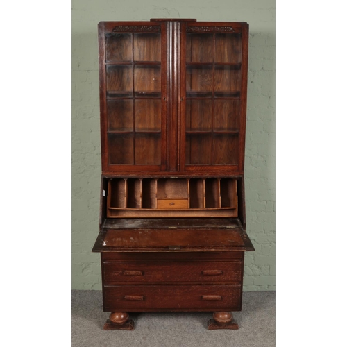 393 - A 1930's oak bureau bookcase.

Hx198cm
Wx92cm
Dx42cm