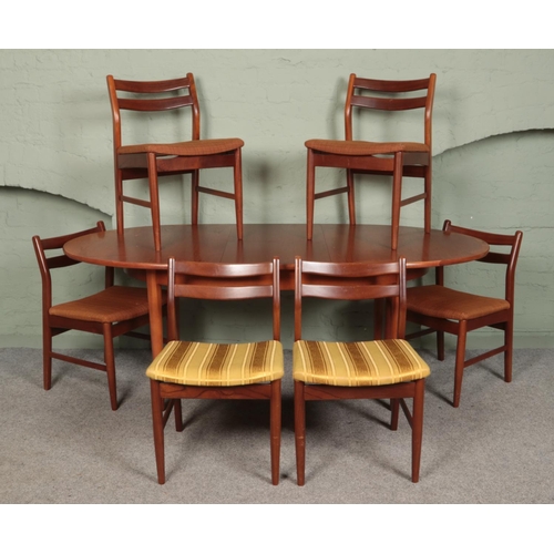 400 - A retro teak extending dining table, with six chairs. Dimensions (extended): Height: 91cm, Width: 19... 