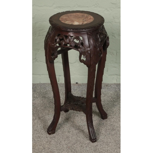 401 - An oriental hardwood jardiniere stand profusely carved throughout with inset marble top.

Hx60cm