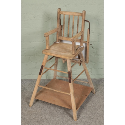 402 - A scrubbed oak metamorphic child's highchair.