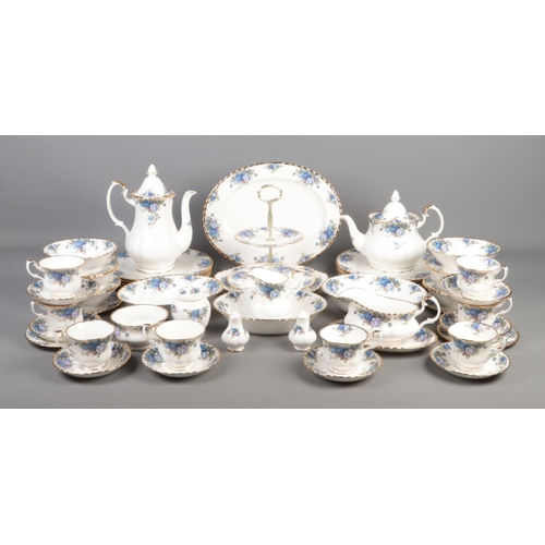 A Royal Albert Moonlight Rose tea set with teapot, coffee pot, gravy boat, cups and saucers, dinner plates, side plates, serving plate, desert bowls, salt and pepper shaker, cake stand, ginger jar etc. Approximately 51 pieces.