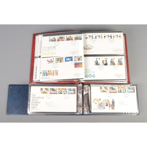 71 - A collection of first day covers, across two albums. To include commemorative, sporting, naval and C... 