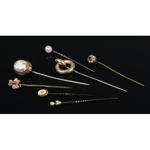 320 - Seven Victorian stick pins, including Cameo, shamrock and seed pearl set examples.