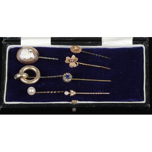 320 - Seven Victorian stick pins, including Cameo, shamrock and seed pearl set examples.