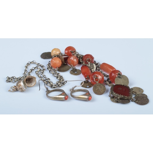 321 - Three pieces of assorted jewellery, to include Indian gilt compass, coral hooped earrings and Easter... 