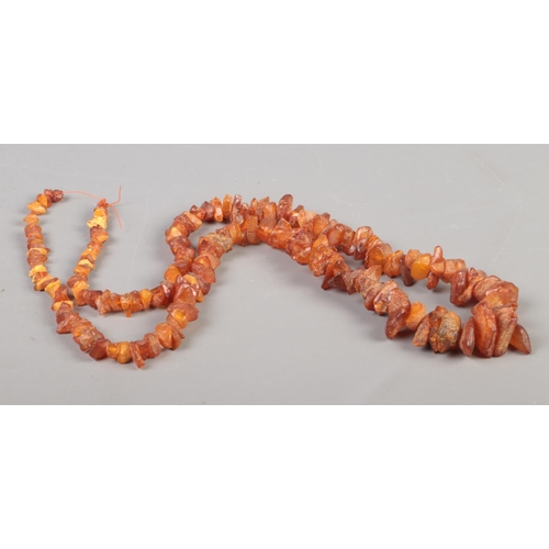 330 - A string of graduated shard amber beads. 54g.