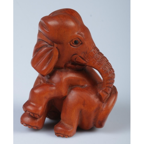 339 - A Japanese carved Netsuke in the form of a elephant.