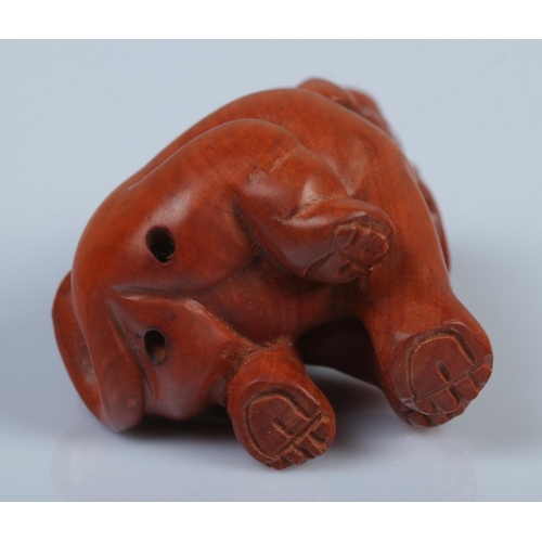 339 - A Japanese carved Netsuke in the form of a elephant.