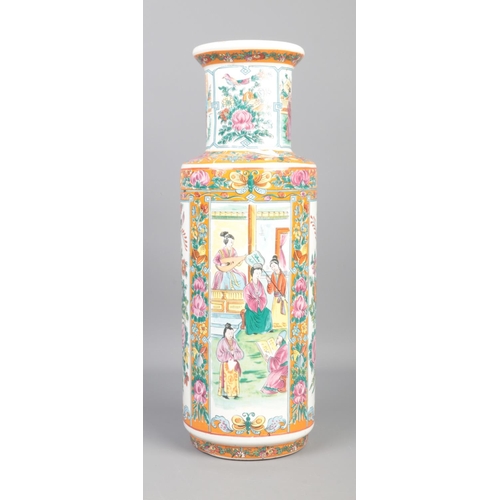 85 - A tall Chinese vase decorated with scenes of musicians, birds and flora. Character marks to base. Ap... 