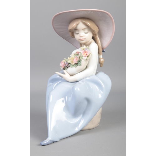 346 - A Lladro figure, titled: 'Fragrant Bouquet Girl', No. 5862.