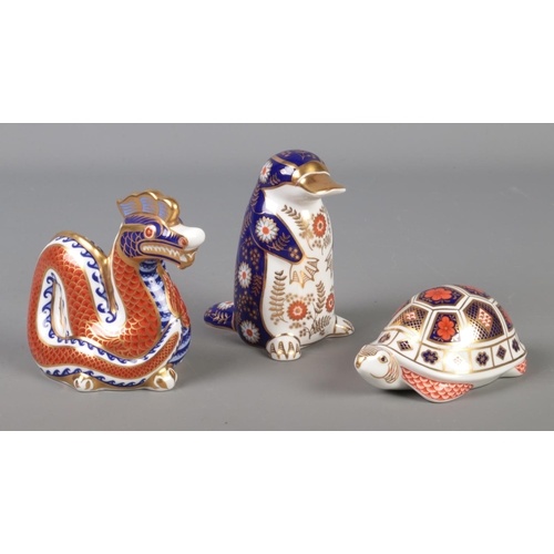 350 - A Collection of three Royal Crown Derby paperweights in the form of a Dragon, Tortoise and a Platypu... 