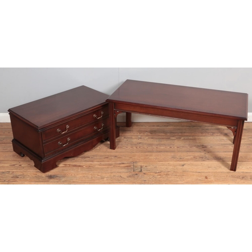 376 - A mahogany coffee table together with similar tv cabinet.