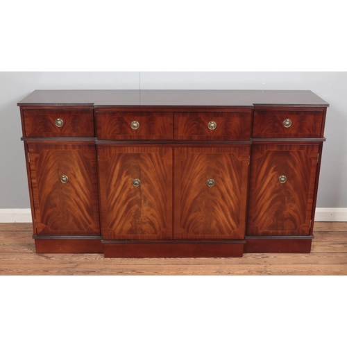 379 - A breakfront flame mahogany sideboard Hx90cm Wx165cm Dx44cm.