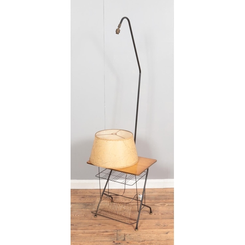 381 - A French floor lamp featuring small built in side table.