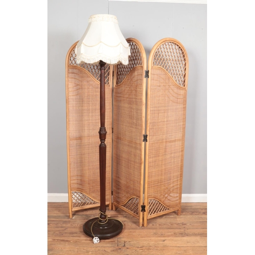 384 - A bamboo rattan folding screen/room divider together with a standard lamp.