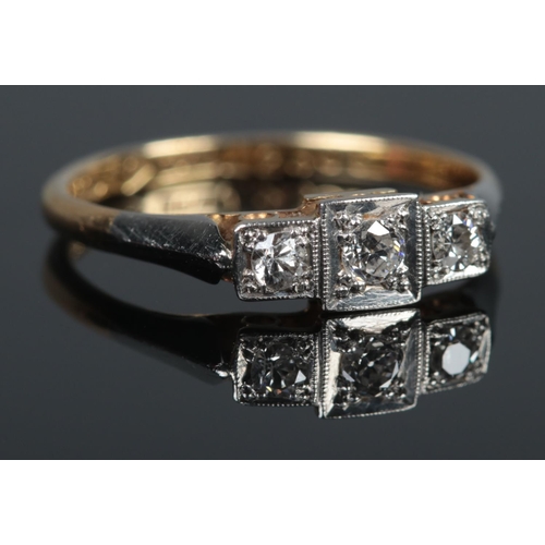 363 - An Art Deco 18ct Gold, Platinum and three stone Diamond ring. Size L. Total weight: 1.9g.