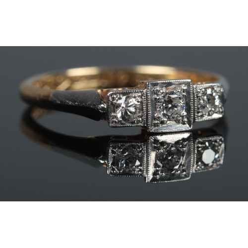 363 - An Art Deco 18ct Gold, Platinum and three stone Diamond ring. Size L. Total weight: 1.9g.