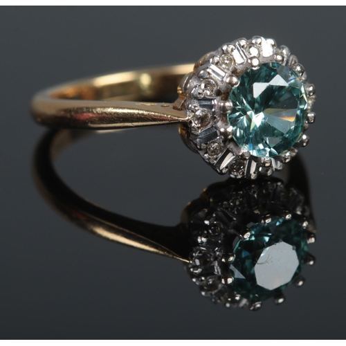 365 - An 18ct Gold, Blue Zircon and Diamond cluster ring. Size K. Total weight: 3.5g.