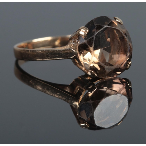 369 - A 9ct Gold smoky quartz dress ring. Diameter of stone: 13mm. Size M½. Total weight: 3.6g