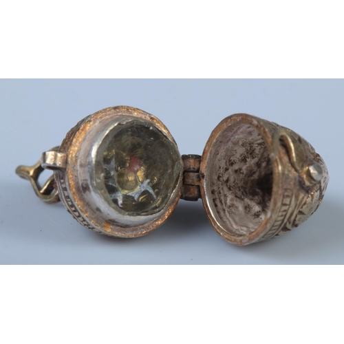 371 - Three pieces of assorted jewellery, to include Indian gilt compass, coral hooped earrings and Easter... 