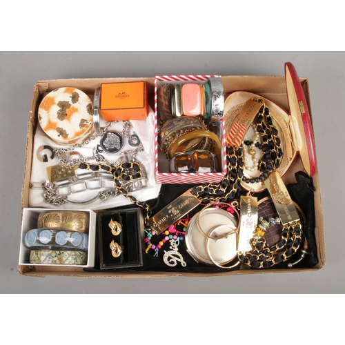 109 - A tray of vintage and fashion dress jewellery. To include Versace fob, D&G chain, earrings and bangl... 