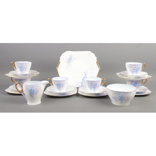 110 - A six place Shelley part tea service, in the Wisteria pattern. Contains cups, saucers, side plates, ... 