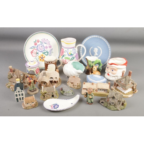 130 - A collection of ceramics. Includes Poole, Wedgwood, Birds Santa jug, Lilliput Lane etc.