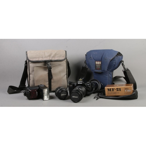 134 - A Nikon F-801 camera, with Nikon Nikkor 70-210mm lens, together with accessory bag. Accessories incl... 