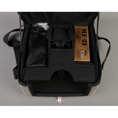 134 - A Nikon F-801 camera, with Nikon Nikkor 70-210mm lens, together with accessory bag. Accessories incl... 