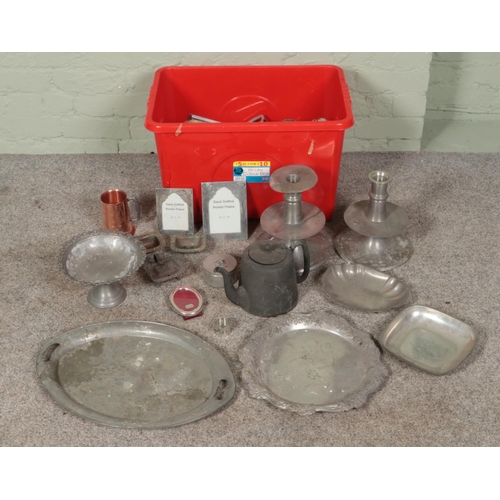 180 - A large box of metalwares. Includes large trays, tankards, photo frames, teapots, jugs, etc.