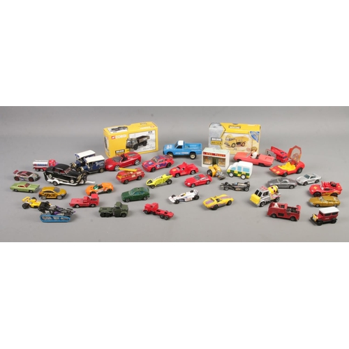 36 - A collection of diecast vehicles, including boxed Corgi 'Building Britain', Matchbox Speed Kings and... 
