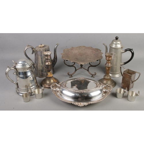 47 - A quantity of metalware. Includes silver plate tureen, ornate teapot with mother of pearl finial, ca... 