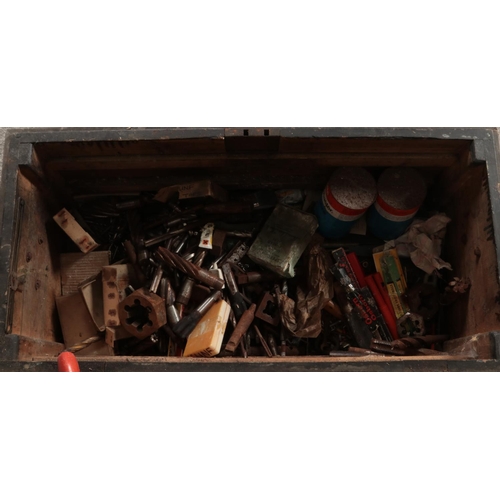 271 - A wooden twin handled engineers chest with contents of tools. Includes drill bits, motors, etc.