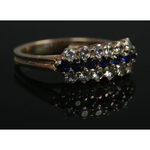 354 - A 9ct Gold three row dress ring set with paste and sapphire coloured stones. Size N½. Total weight: ... 