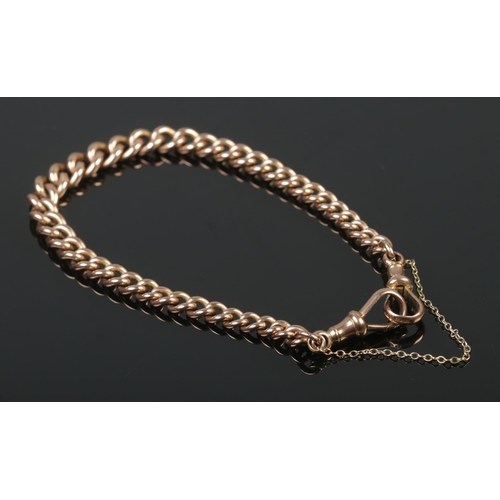 381 - A 9ct Rose Gold curb link bracelet, with each link stamped 375. Attached by two dog clips, stamped H... 