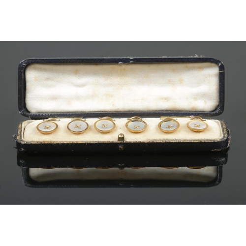 385 - A cased set of six 9ct Gold and Mother of Pearl buttons, in fitted case. Stamped 9ct and GAF to the ... 