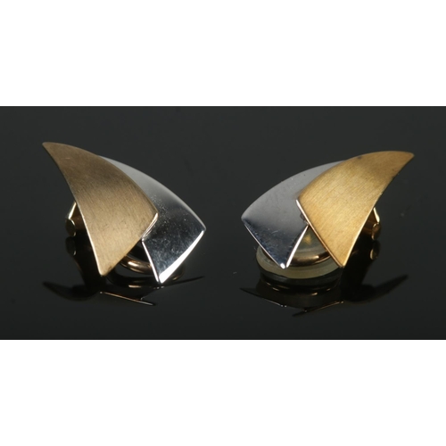386 - A pair of 9ct Gold two-tone clip on earrings, assayed for Edinburgh, with makers mark DC. Total weig... 