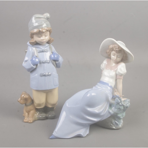 436 - Two Nao porcelain figures. Includes travelling girl with dog and reclining girl with bird.