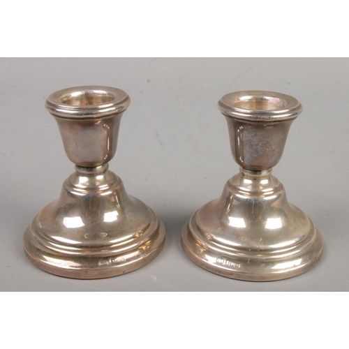 440 - A pair of silver dwarf candlesticks. Assayed Birmingham 1962 by Sanders & Mackenzie. Height 7cm. Gro... 