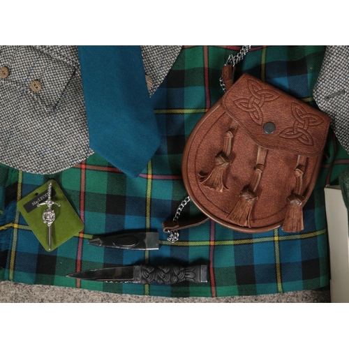 443 - A collection of Scottish clothing and accessories. Includes Macnaughton's wool jacket along with tar... 